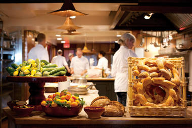 Guests of Chez Panisse have a unique view of the kitchen as their meal is prepared. 